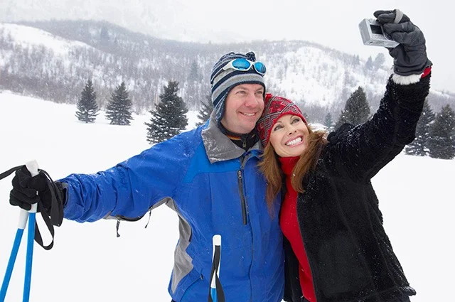 Skiing Couple Posing for Photo